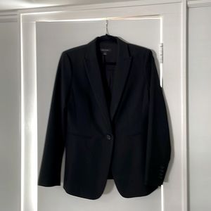 Ann Taylor - black spring suit jacket; material is rayon & polyester.